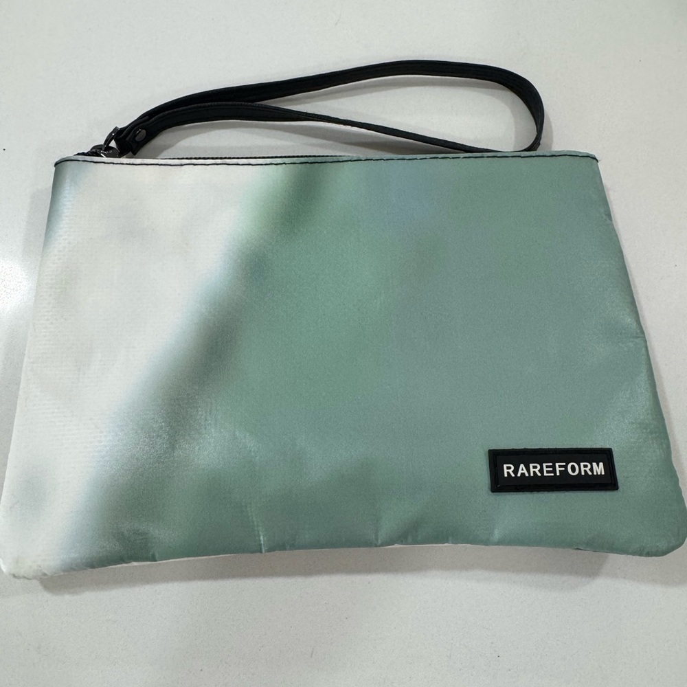 Rareform unisex Green pouch made from recycled billboards